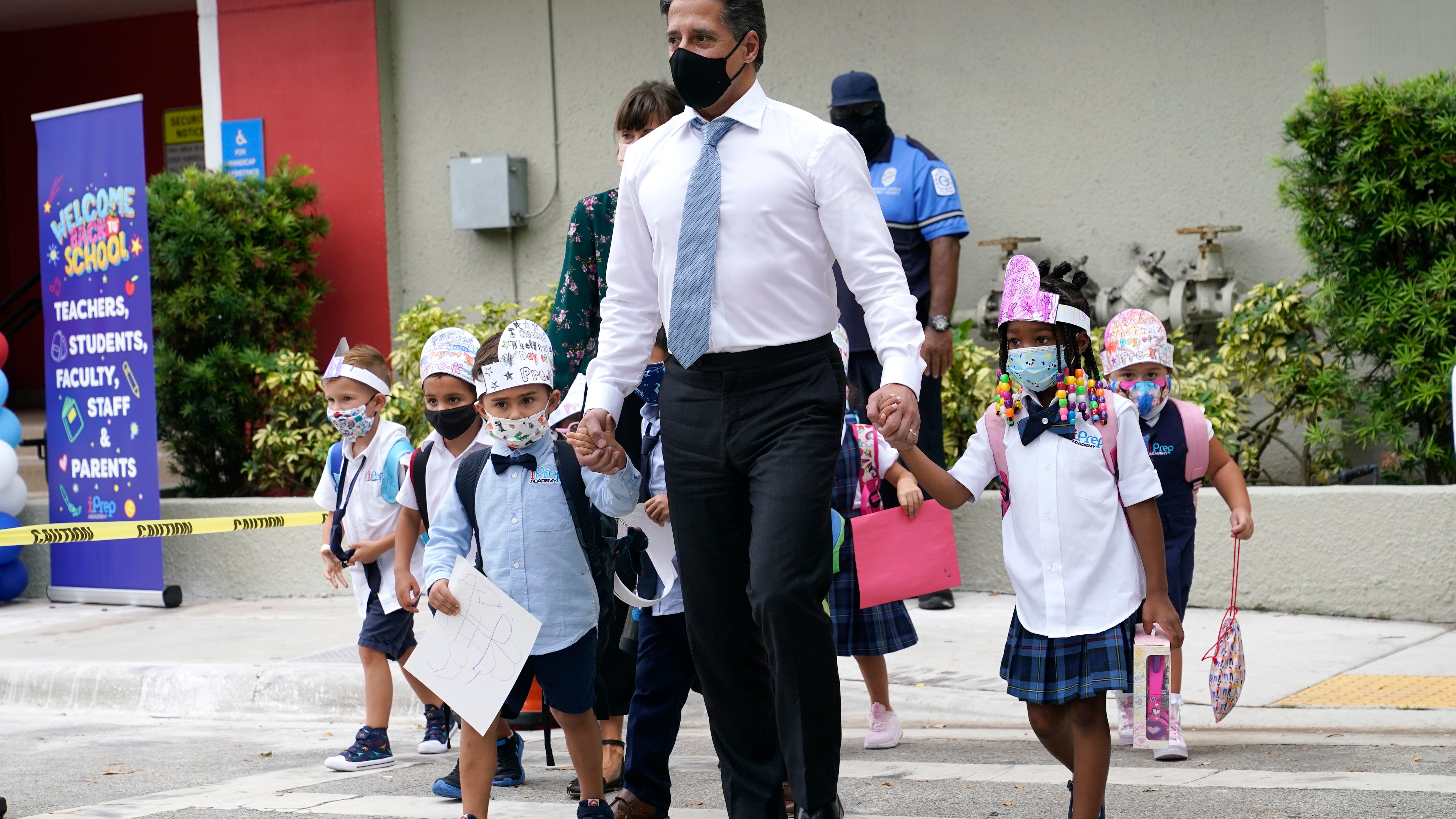 The Latest: Court reinstates Fla ban on school mask mandates