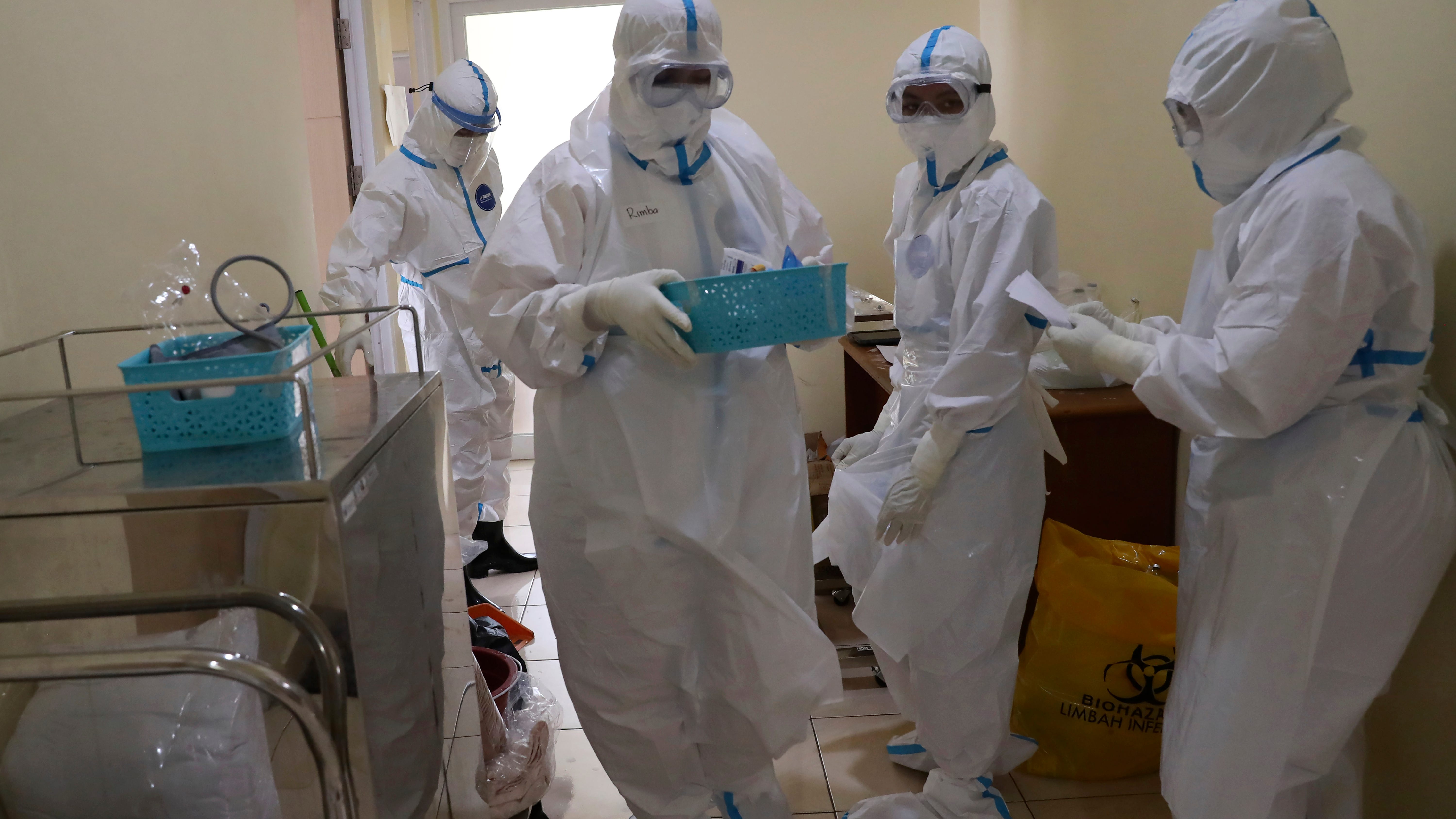 Rapid virus spread through Indonesia taxes health workers