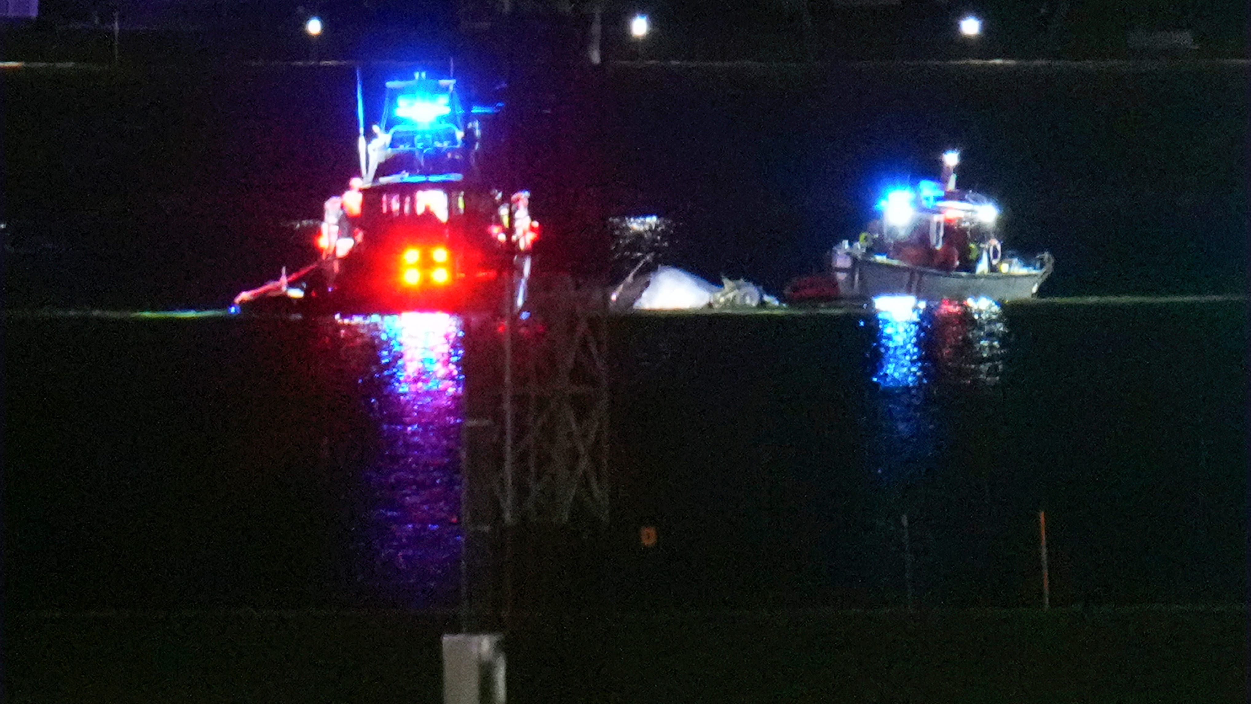 Passenger jet with 64 aboard collides with Army helicopter while landing at Reagan Airport near DC