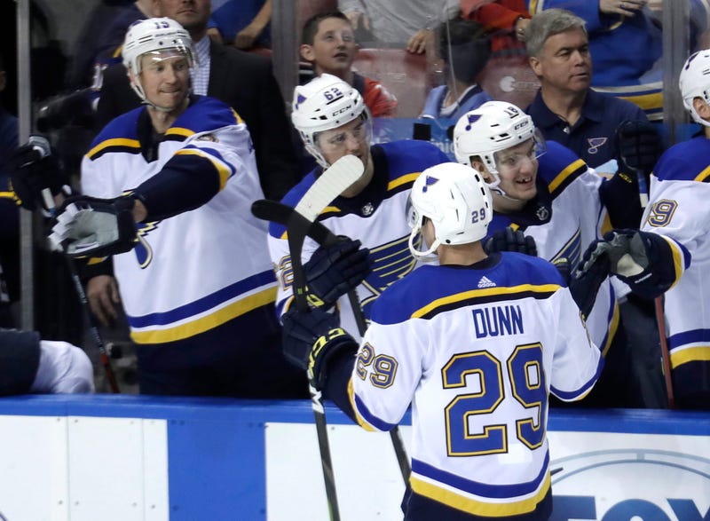 St. Louis Blues defenseman Vince Dunn (29) is congratulated after scoring the game-winning goal