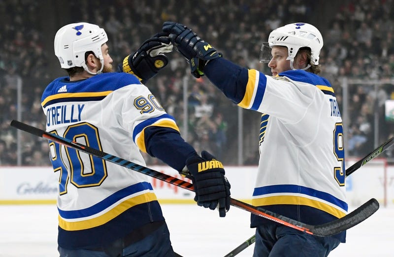 St. Louis Blues' Ryan O'Reilly (90) congratulates teammate Vladimir Tarasenko (91), of Russia on scoring a goal against the Minnesota Wild
