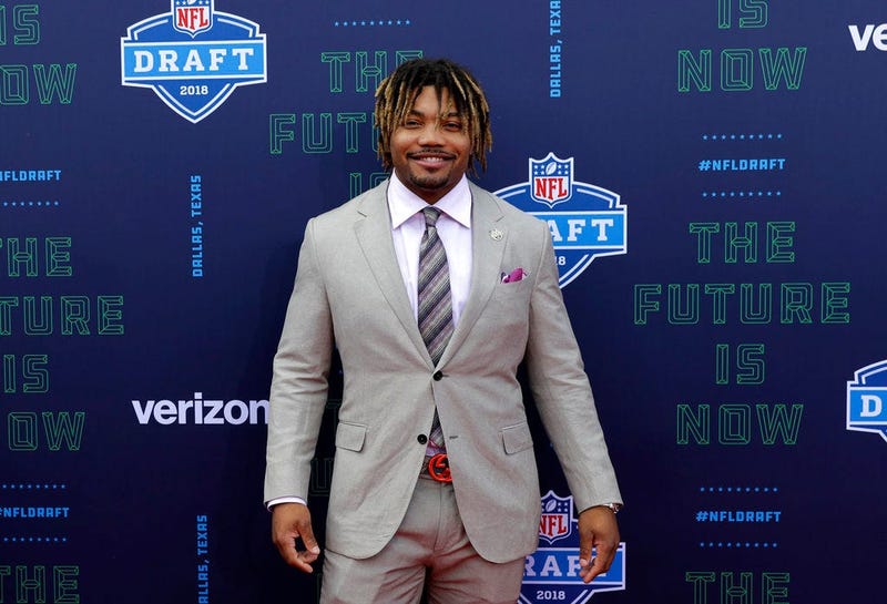 LSU's Derrius Guice poses for photos on the red carpet during the first round of the NFL football draft, Thursday, April 26, 2018, in Arlington, Texas. (AP Photo/Eric Gay)