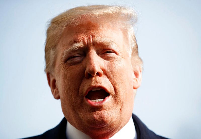 President Donald Trump talks to media before boarding Marine One on the South Lawn of the White House in Washington, Saturday, Dec. 8, 2018, for the short trip to Andrews Air Force Base en route to Philadelphia to attend the Army-Navy Football Game. (AP P