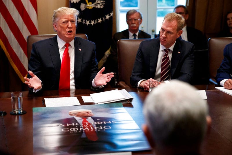 Acting Secretary of Defense Patrick Shanahan, right, listens as President Donald Trump speaks during a cabinet meeting at the White House, Wednesday, Jan. 2, 2019