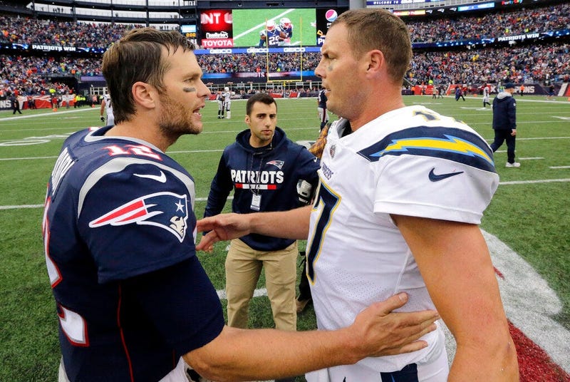 New England Patriots quarterback Tom Brady (12) and Los Angeles Chargers quarterback Philip Rivers