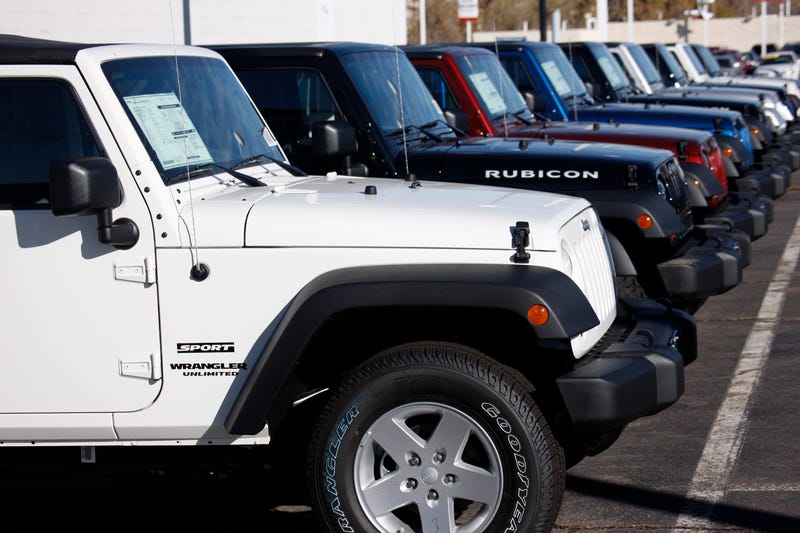 Wranglers sit at a Chrysler/Jeep dealership