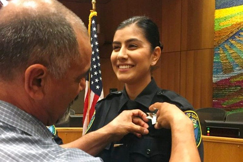 Williams Pioneer Review shows Merced Corona, left, pins his daughter Natalie Corona's badge on her uniform during a swearing-in ceremony in Davis