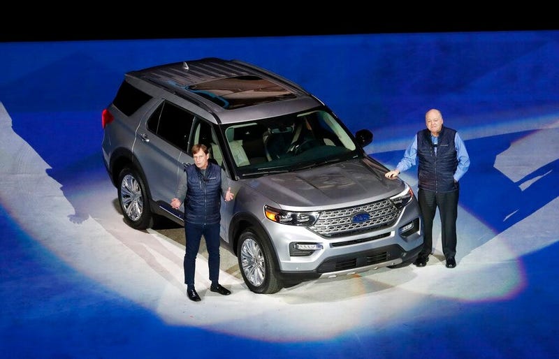 Ford Motor Co., President, Global Markets Jim Farley, left, and President and CEO Jim Hackett stand next to the redesigned 2020 Ford Explorer during its unveiling, in Detroit.