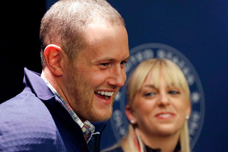U.S. figure skating pairs Caydee Denney and John Coughlin speak with reporters during a news conference in Park City, Utah