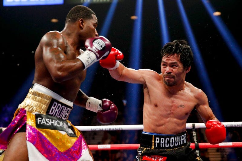 Manny Pacquiao, right, throws a right to Adrien Broner in the WBA welterweight title boxing match Saturday, Jan. 19, 2019, in Las Vegas