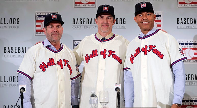 Baseball Hall of Fame inductees Edgar Martinez, left, Mike Mussina, center, and Mariano Rivera, right