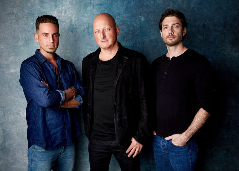Wade Robson, from left, director Dan Reed and James Safechuck pose for a portrait to promote the film "Leaving Neverland"