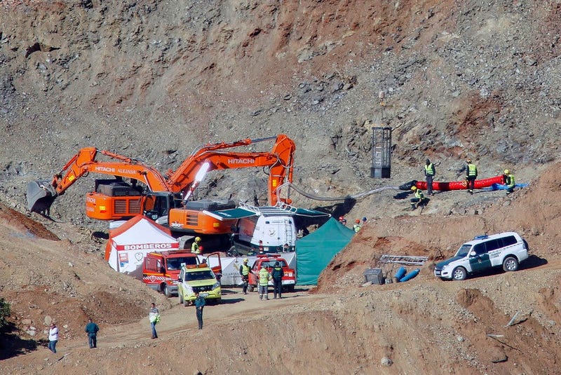 drill and excavating machinery work on top of the mountain next to a deep borehole to reach a 2-year-old boy trapped there for twelve days near the town of Totalan in Malaga, Spain