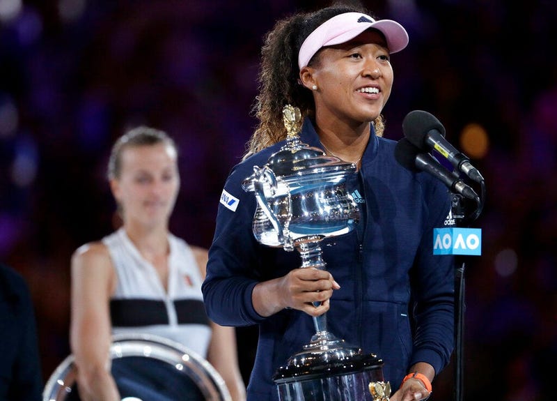 Japan's Naomi Osaka holds her trophy after defeating Petra Kvitova, left, of the Czech Republic during the women's singles final at the Australian Open tennis championships in Melbourne, Australia, Saturday, Jan. 26, 2019
