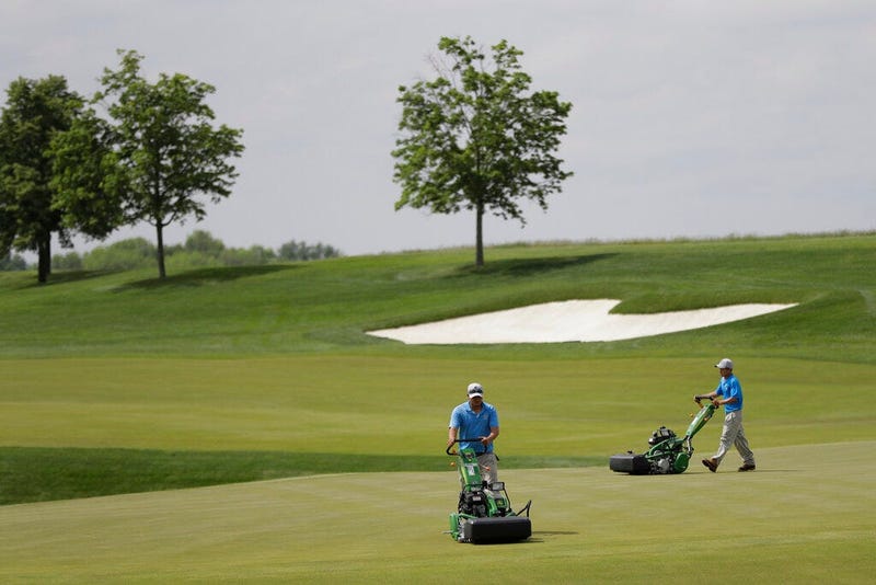 groundskeepers work at Trump National Golf Club in Bedminster, N.J. The Trump Organization