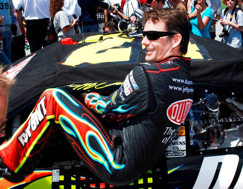 Jeff Gordon climbing into his car as he prepares to start the NASCAR Sprint Cup Series Aaron's 499 auto race at Talladega Superspeedway in Talladega