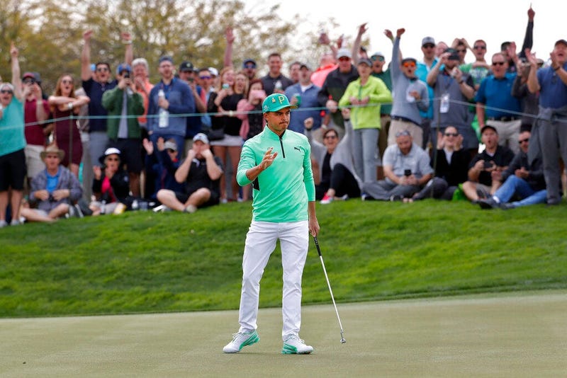Rickie Fowler waves after making a birdie putt on the fifth green during the third round of the Phoenix Open PGA golf tournament, Saturday, Feb. 2, 2019