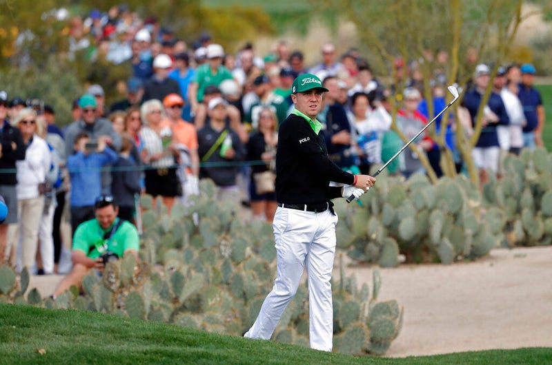 Justin Thomas hits from the second fairway during the third round of the Phoenix Open PGA golf tournament, Saturday, Feb. 2, 2019, in Scottsdale, Ariz