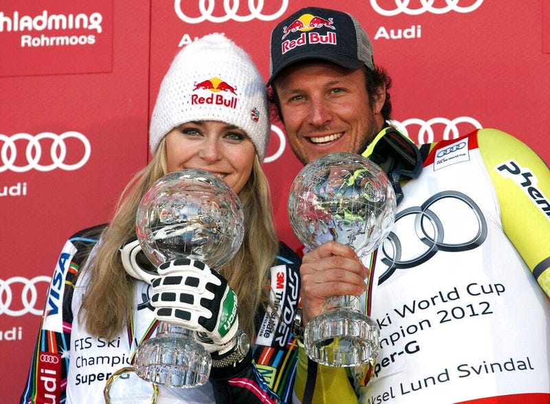  Lindsey Vonn, of the United States, left, and Norway's Aksel Lund Svindal pose with their trophies of the alpine ski, women's and men's World Cup super-G discipline titles, in Schladming, Austria.