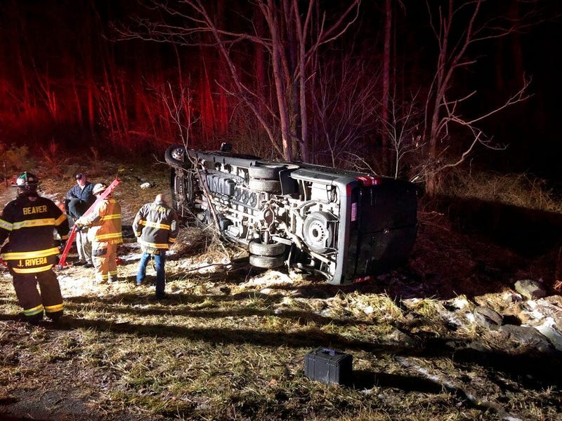 photo provided by WOAY-TV authorities respond after a charter bus carrying a high school girls basketball team rolled over in Oak Hill, W.Va.