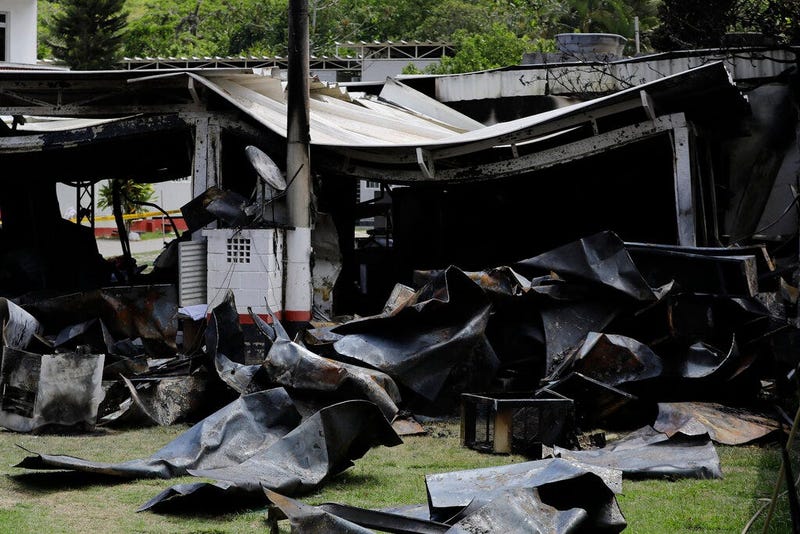 Debris from the deadly fire at the Flamengo soccer club training complex litters the ground in Rio de Janeiro, Brazil, Friday, Feb. 8, 2019