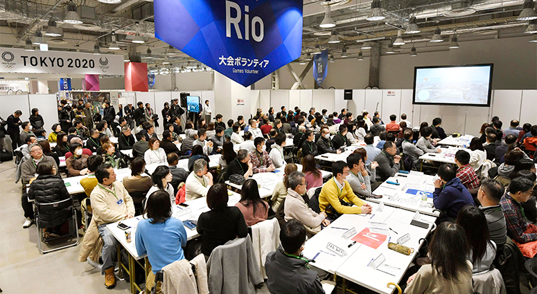 invitees listen during an orientation for volunteers for the Tokyo 2020 Olympics