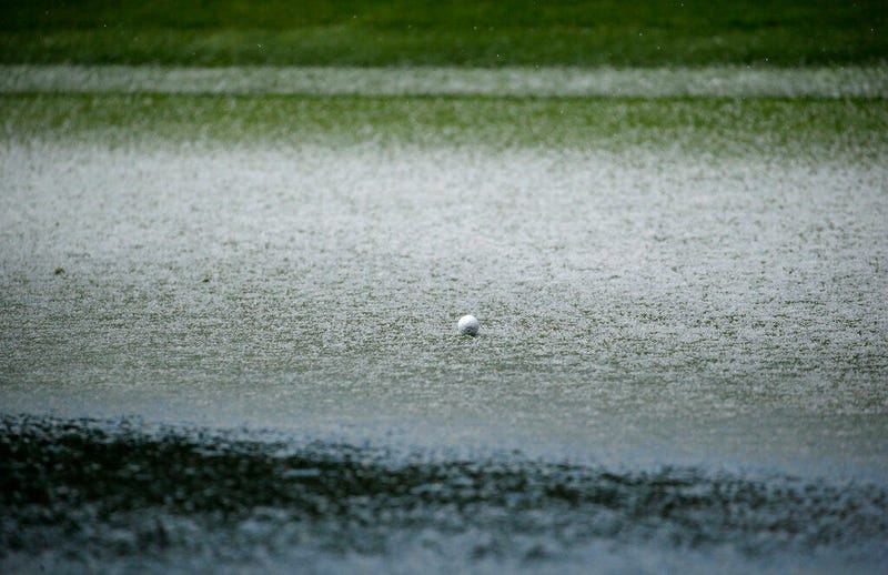The ball of Scott Langley is surrounded by hail on the second green of the Pebble Beach Golf Links during the final round of the AT&T Pebble Beach Pro-Am golf tournament Sunday, Feb. 10, 2019, in Pebble Beach, Calif. Play was suspended following hail