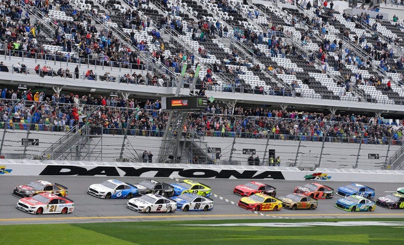 Paul Menard (21) and Kyle Busch, top left, lead the field of cars to start the NASCAR Clash auto race at Daytona International Speedway, Sunday, Feb. 10, 2019, in Daytona Beach, Fla.
