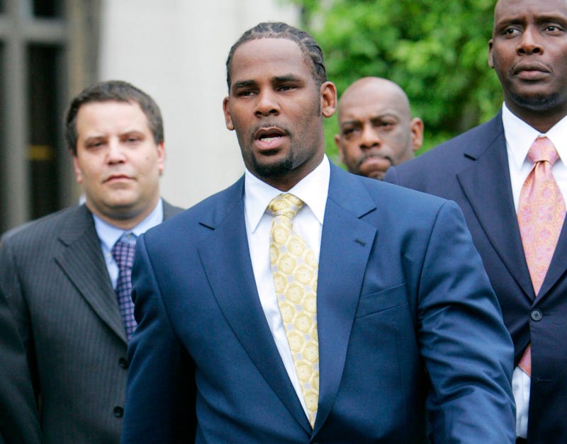 In this June 13, 2008 file photo, R&B singer R. Kelly leaves the Cook County Criminal Court Building in Chicago after a jury found him not guilty on all counts in his child pornography trial.