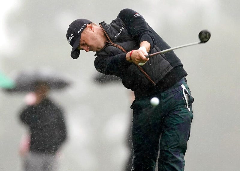 Justin Thomas hits his second shot on the 18th hole during a rain shower in the second round of the Genesis Open golf tournament at Riviera Country Club on Friday, Feb. 15, 2019, in the Pacific Palisades area of Los Angeles.