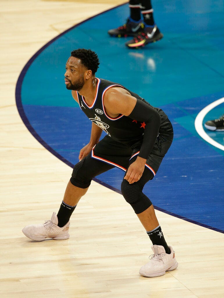 Team LeBron's Dwayne Wade, of the Miami Heat, works against Team Giannis during the second half of an NBA All-Star basketball game, Sunday, Feb. 17, 2019, in Charlotte, N.C.