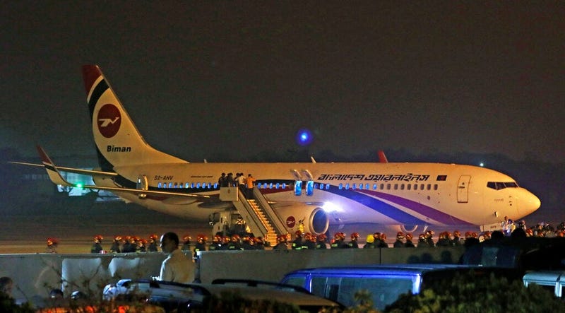 Bangladesh’s state-run Biman Bangladesh Airlines flight is seen after it made an emergency landing at the airport in Chittagong, Bangladesh, Sunday, Feb.24, 2019