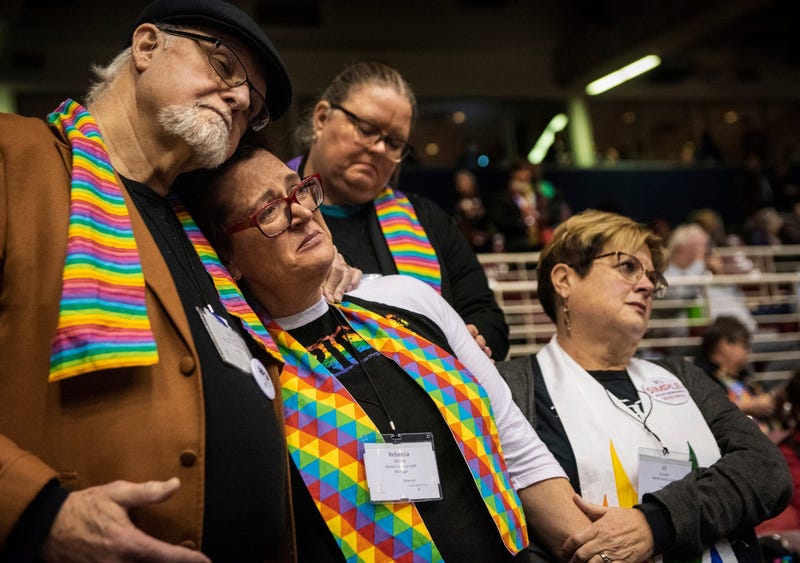 Ed Rowe, left, Rebecca Wilson, Robin Hager and Jill Zundel, react to the defeat of a proposal that would allow LGBT clergy and same-sex marriage within the United Methodist Church at the denomination’s 2019 Special Session of the General Conference in St.