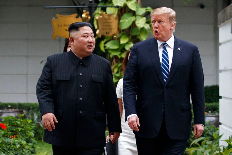 U.S. President Donald Trump and North Korean leader Kim Jong Un take a walk after their first meeting at the Sofitel Legend Metropole Hanoi hotel, Thursday, Feb. 28, 2019, in Hanoi