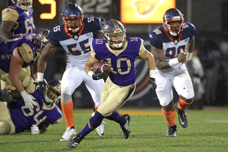 Atlanta Legends receiver Justin Thomas (10) runs with a reception in front of Orlando Apollos linebacker Andrew Ankrah (55) and defensive end Anthony Moten Jr. (98) during the second half of an Alliance of American Football game