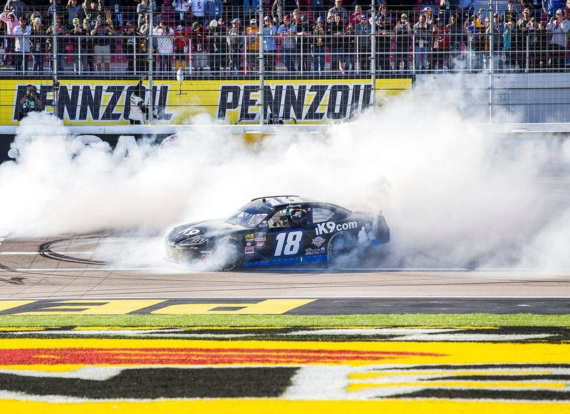 Kyle Busch celebrates with a burnout after winning the NASCAR Xfinity Series auto race Saturday, March 2, 2019, at Las Vegas Motor Speedway in Las Vegas