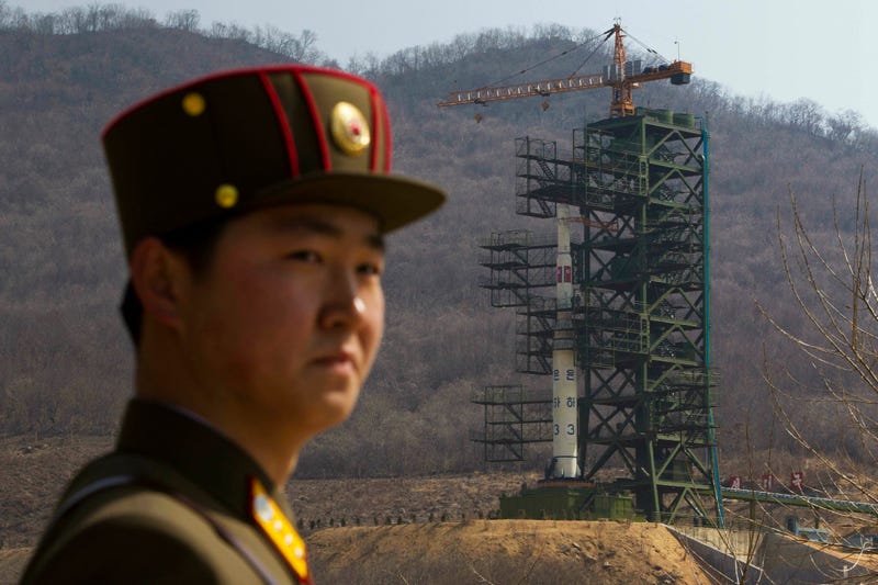 File Photo: A soldier stands in front of a rocket at a launching site in North Korea