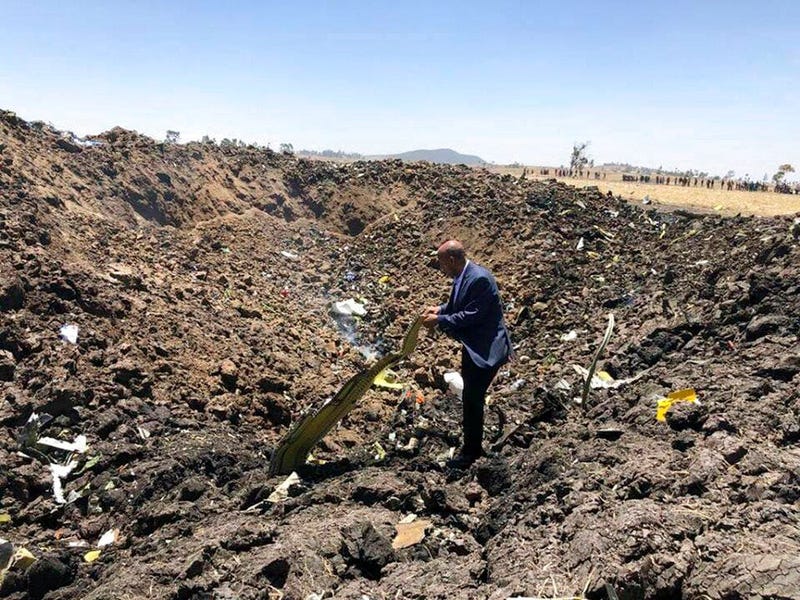 Ethiopian Airlines Facebook page, the CEO of Ethiopian Airlines, Tewolde Gebremariam, looks at the wreckage of the plane that crashed shortly after takeoff from Addis Ababa, Ethiopia