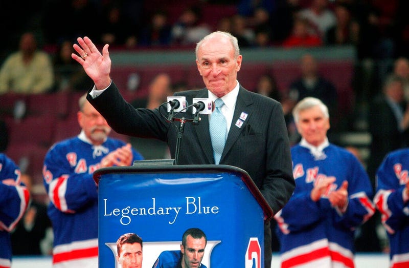 Harry Howell waves to the crowd during a ceremony to retire his number before the Ranger's hockey game at Madison Square Garden in New York.