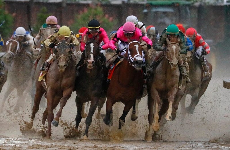 Luis Saez riding Maximum Security, second from right, goes around turn four with Flavien Prat riding Country House, left, Tyler Gaffalione riding War of Will and John Velazquez riding Code of Honor, right, during the 145th running of the Kentucky Derby ho