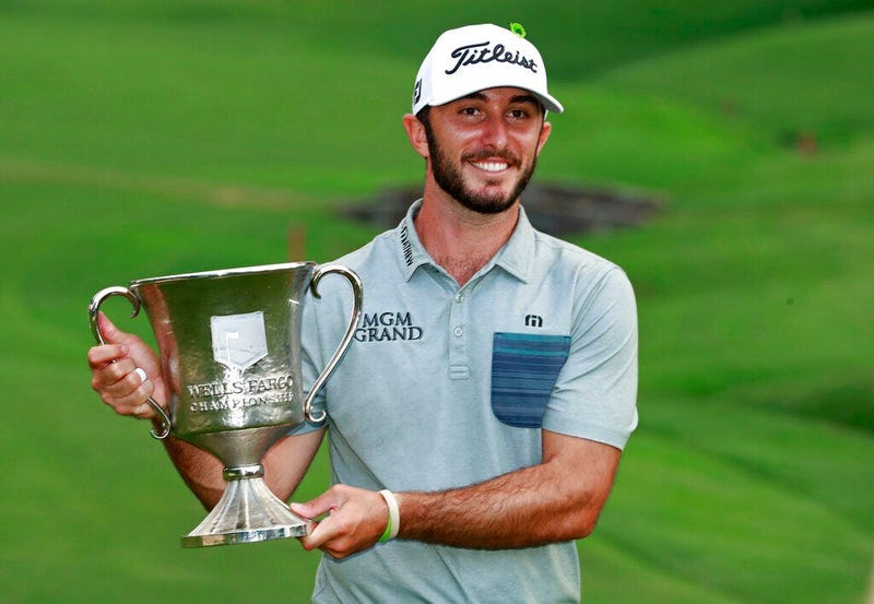 Max Homa poses with the trophy after winning the Wells Fargo Championship golf tournament at Quail Hollow Club in Charlotte, N.C., Sunday, May 5, 2019.