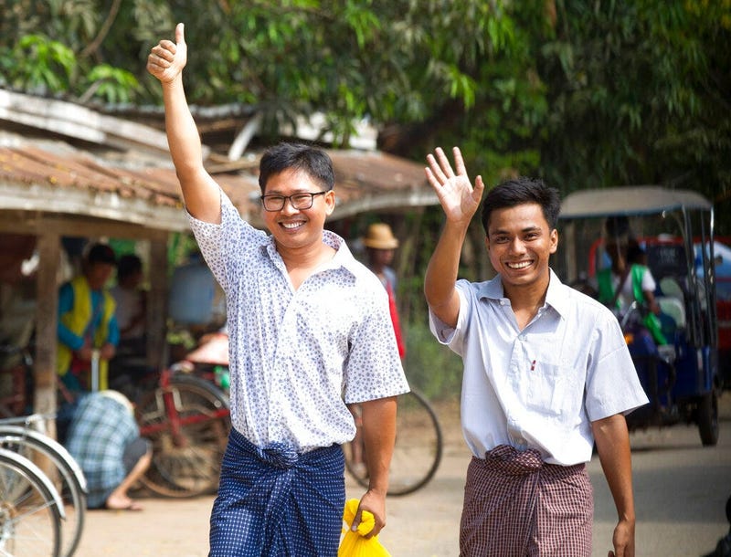 Reuters journalists Wa Lone, left, and Kyaw She Oo wave as they walk out from Insein Prison after being released in Yangon, Myanmar Tuesday, May 7, 2019.