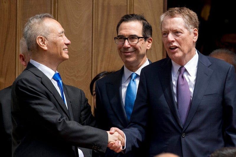 Treasury Secretary Steve Mnuchin, center, and United States Trade Representative Robert Lighthizer, right, speak with Chinese Vice Premier Liu He, left, as he departs the Office of the United States Trade Representative in Washington, Friday, May 10, 2019