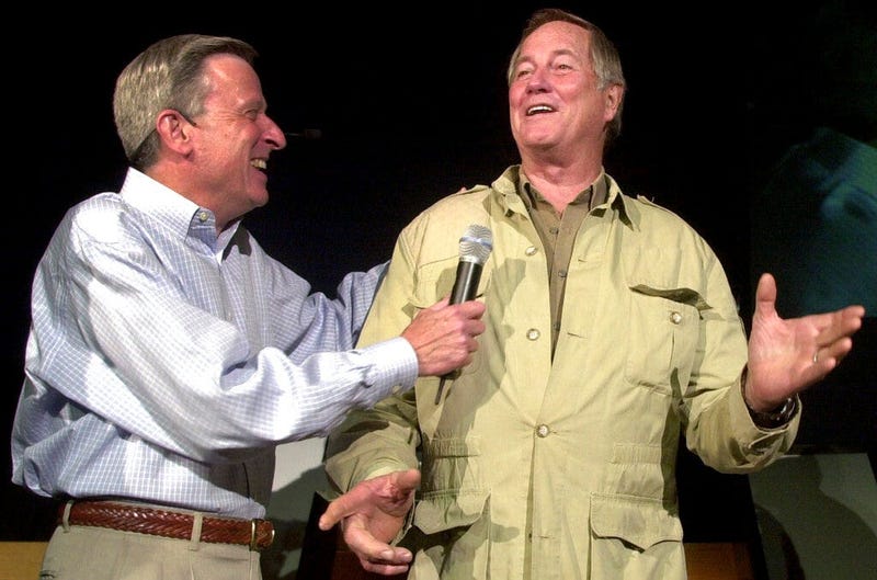 Mutual of Omaha's John Hildenbiddle, left, talks with former nature television show "Wild Kingdom" co-host Jim Fowler in Omaha, Neb. Fowler died Wednesday, May 8, 2019, at his home in Norwalk, Conn. He was 89.