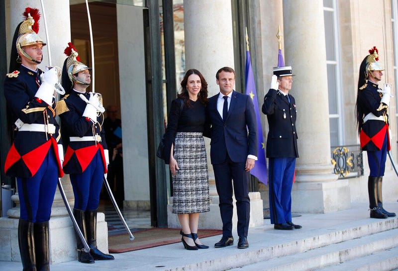 New Zealand Prime Minister Jacinda Ardern, center left, is greeted by French President Emmanuel Macron, center right, as she arrives at the Elysee Palace, in Paris, Wednesday, May 15, 2019.