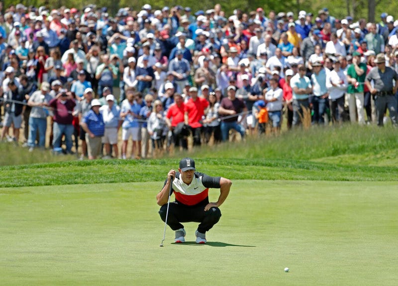 Brooks Koepka lines up a putt on the fifth green during the first round of the PGA Championship golf tournament, Thursday, May 16, 2019, at Bethpage Black in Farmingdale, N.Y. 