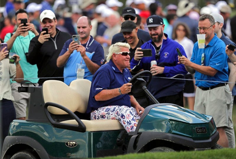 John Daly drives to the 10th tee in a golf cart during the first round of the PGA Championship golf tournament, Thursday, May 16, 2019, at Bethpage Black in Farmingdale, N.Y.
