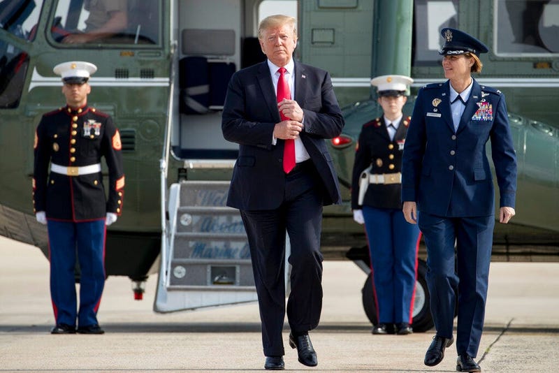 President Donald Trump walks across the tarmac to board Air Force One at Andrews Air Force Base,