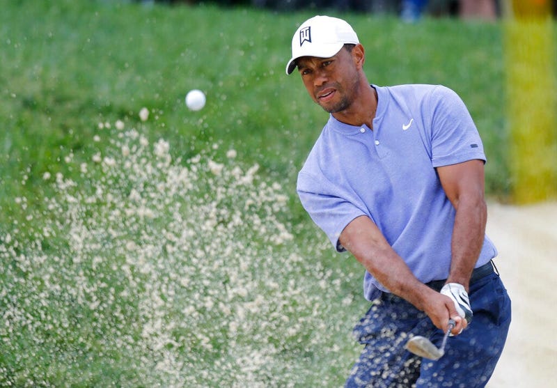Tiger Woods hits from the sand on the 13th hole during the first round of the Memorial golf tournament Thursday, May 30, 2019, in Dublin, Ohio.