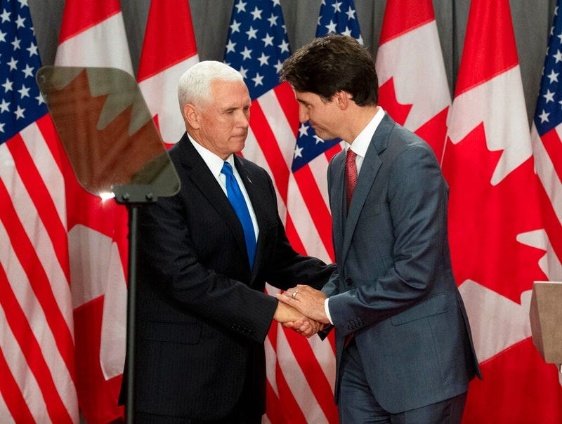 Canadian Prime Minister Justin Trudeau, right, and U.S. Vice President Mike Pence listen during a joint news conference in Ottawa, Thursday, May 30, 2019. 